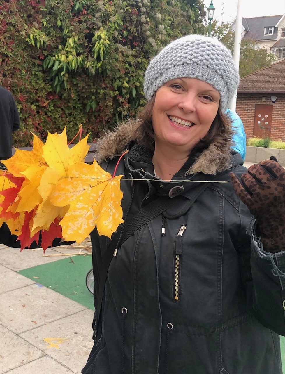 Volunteer collecting leaves